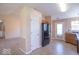 This spacious kitchen has updated appliances, neutral paint, and access to the front door and sunroom at 105 Fountain Dr, Mooresville, IN 46158