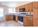 Bright kitchen with oak cabinets, newer appliances, and ample counter space at 105 Fountain Dr, Mooresville, IN 46158