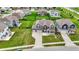 Aerial view of a home in a suburban neighborhood with green lawns and mature trees at 10811 Wild Orchard Ln, Indianapolis, IN 46239