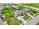 Aerial view of a home in a suburban neighborhood with green lawns and mature trees at 10811 Wild Orchard Ln, Indianapolis, IN 46239