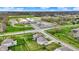 Aerial view of a home in a suburban neighborhood with a school nearby at 10811 Wild Orchard Ln, Indianapolis, IN 46239