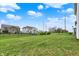 Spacious backyard featuring green grass, privacy fencing, and manicured landscaping at 10811 Wild Orchard Ln, Indianapolis, IN 46239