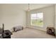 Bedroom featuring carpet flooring, neutral paint, and large window at 10811 Wild Orchard Ln, Indianapolis, IN 46239