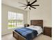 Bedroom with a window, neutral paint, and a ceiling fan at 10811 Wild Orchard Ln, Indianapolis, IN 46239