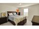 Bedroom featuring a window, dressers, and a bed with a yellow comforter, giving the room a cozy feel at 10811 Wild Orchard Ln, Indianapolis, IN 46239
