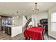 Dining area adjacent to kitchen, featuring hardwood floors and ample natural light at 10811 Wild Orchard Ln, Indianapolis, IN 46239