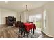 Inviting dining room with hardwood floors, large windows, and an elegant dining set at 10811 Wild Orchard Ln, Indianapolis, IN 46239