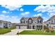 Beautiful two-story home with a three-car garage, manicured lawn, and welcoming front porch at 10811 Wild Orchard Ln, Indianapolis, IN 46239
