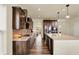 Stylish kitchen with dark wood cabinets, stainless steel appliances, and a center island at 10811 Wild Orchard Ln, Indianapolis, IN 46239