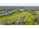 Expansive aerial view showing the community, golf course, and nearby pond at 10844 Bentwater Ln, Fishers, IN 46037
