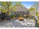 Inviting backyard deck featuring rocking chairs and a small coffee table, perfect for relaxing and enjoying the outdoors at 10844 Bentwater Ln, Fishers, IN 46037