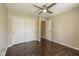 Bedroom with hardwood floors, closet, ceiling fan and a sun-filled window at 10844 Bentwater Ln, Fishers, IN 46037