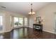 Bright dining room with large bay windows and hardwood floors at 10844 Bentwater Ln, Fishers, IN 46037