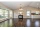 Bright dining room with large windows, dark wood floors, and natural light at 10844 Bentwater Ln, Fishers, IN 46037