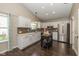 Charming kitchen with stainless steel appliances, white cabinets, and an island at 10844 Bentwater Ln, Fishers, IN 46037