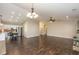 Spacious living room open to the kitchen with modern lighting and hardwood floors at 10844 Bentwater Ln, Fishers, IN 46037