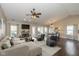 Cozy living room with a fireplace, sofa, and dining area at 10844 Bentwater Ln, Fishers, IN 46037