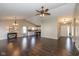 Open-concept living room boasts hardwood floors, vaulted ceilings, and flows seamlessly into the kitchen area at 10844 Bentwater Ln, Fishers, IN 46037
