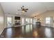 Cozy living room with a fireplace, television, and dark wood floors at 10844 Bentwater Ln, Fishers, IN 46037