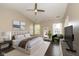 Well-lit main bedroom with a large window, soft rug and tasteful decor at 10844 Bentwater Ln, Fishers, IN 46037