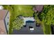 Aerial view of beautiful backyard with large deck, manicured lawn and mature trees in a desirable neighborhood at 10844 Bentwater Ln, Fishers, IN 46037