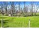 Expansive backyard with mature trees and well-manicured lawn at 11006 Timber Ln, Carmel, IN 46032