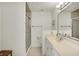 Well-lit bathroom with a glass-enclosed shower and a single sink vanity at 11006 Timber Ln, Carmel, IN 46032