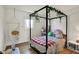 Whimsical bedroom with canopy bed and hammock chair at 11006 Timber Ln, Carmel, IN 46032