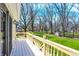 Inviting deck offering views of the expansive, tree-lined backyard at 11006 Timber Ln, Carmel, IN 46032