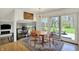 Light-filled dining area features hardwood floors and sliding glass doors to a large backyard at 11006 Timber Ln, Carmel, IN 46032