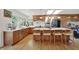 Beautiful kitchen with light wood cabinets, quartz countertops, and modern fixtures at 11006 Timber Ln, Carmel, IN 46032