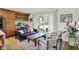 Inviting living room with large window, comfortable seating, and hardwood floors at 11006 Timber Ln, Carmel, IN 46032