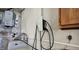 Efficient laundry area with Tesla electric vehicle charging station at 11006 Timber Ln, Carmel, IN 46032