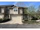 Charming two-story home with attached garage, landscaped yard, and welcoming front door at 11223 Fonthill Dr, Indianapolis, IN 46236
