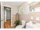 Cozy bathroom with updated toilet and sink plus unique tile decor at 11359 Peacock Dr, Indianapolis, IN 46236