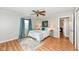 Cozy bedroom has neutral paint colors, wood floors, and a decorative ceiling fan at 11359 Peacock Dr, Indianapolis, IN 46236