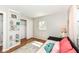 Cozy bedroom featuring hardwood floors, shelves and closet space, perfect for relaxation and storage at 11359 Peacock Dr, Indianapolis, IN 46236