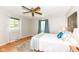 Well-lit bedroom features hardwood floors, windows, and blue decorative accents at 11359 Peacock Dr, Indianapolis, IN 46236