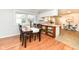 Inviting dining area features wood floors, natural light, and stylish decor at 11359 Peacock Dr, Indianapolis, IN 46236