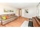 Living room with hardwood floors, a comfortable leather sofa, and neutral wall colors at 11359 Peacock Dr, Indianapolis, IN 46236