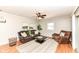 Comfortable living room with hardwood floors, neutral paint, and lots of natural light at 11359 Peacock Dr, Indianapolis, IN 46236