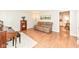 Living room with hardwood floors, a comfortable leather sofa, and a decorative bookshelf at 11359 Peacock Dr, Indianapolis, IN 46236