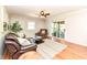 Spacious living room boasts hardwood floors, neutral colors, and sliding glass door access at 11359 Peacock Dr, Indianapolis, IN 46236