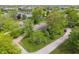Aerial shot of a home with lush greenery, mature trees, and a neighborhood view at 11415 Central E Dr, Carmel, IN 46032