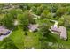 High-angle shot of homes surrounded by mature trees, providing a sense of privacy and serenity at 11415 Central E Dr, Carmel, IN 46032