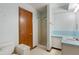 Bathroom with walk-in shower, white vanity, and blue countertop at 11415 Central E Dr, Carmel, IN 46032