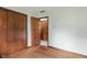 Bedroom with hardwood floors, a large closet, and access to another room at 11415 Central E Dr, Carmel, IN 46032
