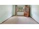 Comfortable bedroom featuring a carpeted floor, window, and wooden furniture at 11415 Central E Dr, Carmel, IN 46032