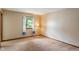 Comfortable bedroom featuring a carpeted floor, window, and a corner lamp at 11415 Central E Dr, Carmel, IN 46032