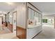 Inviting living room with a bar, white cabinetry, and access to other rooms at 11415 Central E Dr, Carmel, IN 46032